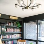 Hudson Valley Wide Aged Brass Wall Sconce - Image 6